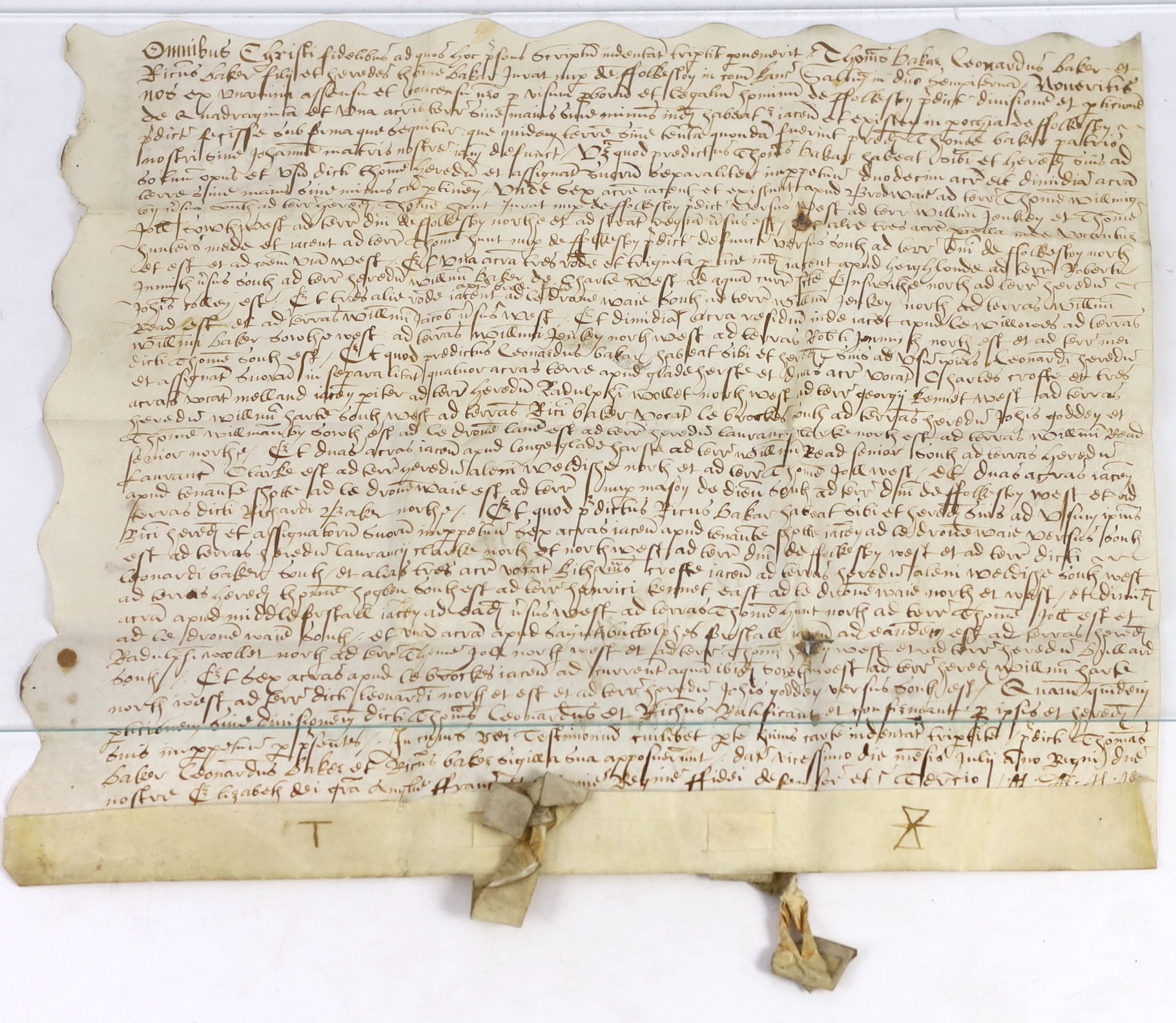 An Elizabethan charter recording the division of property, in Latin, in black ink on vellum, 30 x 37cms.
